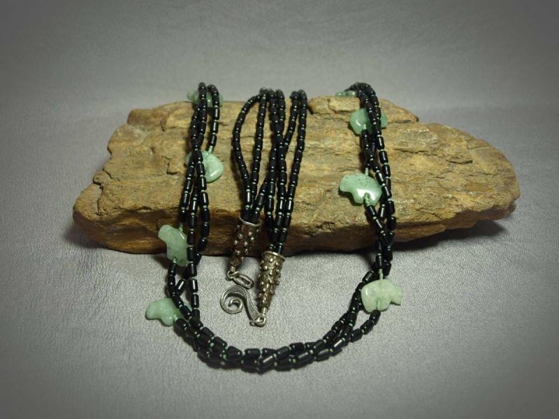 3 Strand Necklace Onyx barrels, Picasso green seed beads, Aventurine Buffalos (12), white brass cones and sterling silver clasp - 33in.