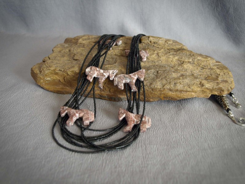 9 Strand Necklace Black seed beads, 8 stone horses, white brass cones and sterling silver clasp - 31 in$120.00