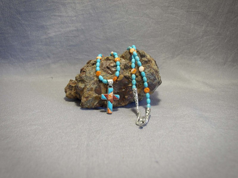 Single strand necklace Turquoise Barrels, Spiney Oyster ovals, Cross Inlay (Turquoise, Spiney Oyster, Coral), and Sterling silver components and clasp - 24 in & 1 in pendent Necklace is $283.00