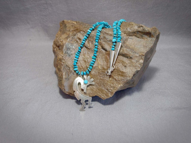 Single Strand necklace Sleeping Beauty Turquoise, Black matte Demi rounds, Sterling Silver Kokopelli Pendent, cones and clasp Necklace is $160.00