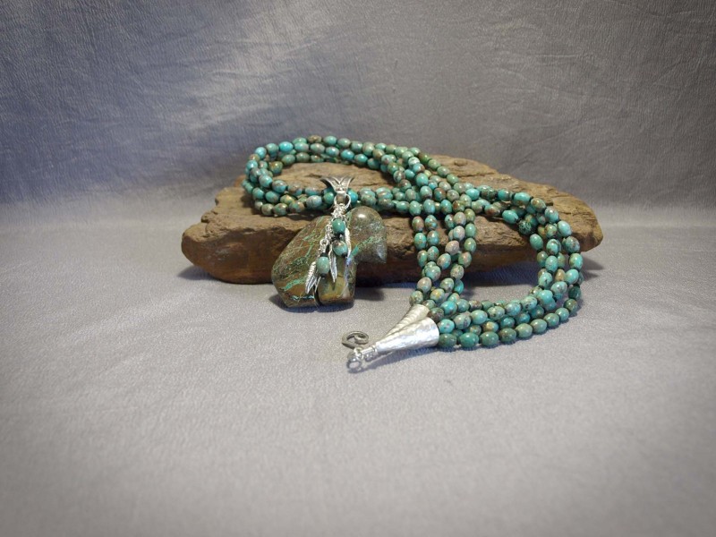 5 strand Turquoise Ovals, Matte black Demi rounds, Buffalo Turquoise Fetish, and Sterling silver bail, cones, components and clasp - 24 in &2.5 in pendent  Necklace is$480.00
