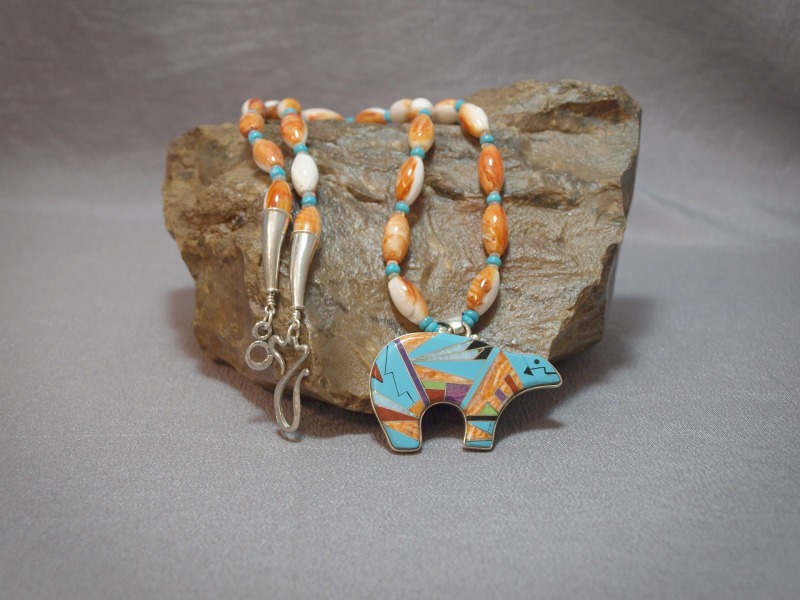 Single strand necklace Spiney Oyster 8x15 Baja & Turquoise & Opal Rondell with a sterling silver Fetish bear Inlay (Apple Coral, Turquoise, Opal, Onyx & Spiney Oyster) pendent, sterling silver cones and clasp - 24 in