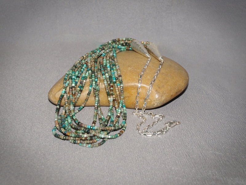 9 strand necklace Faceted Chrysocollas, Sterling silver cones, chain and clasp - adjustable 24 in to 36 in Necklace is $335.00