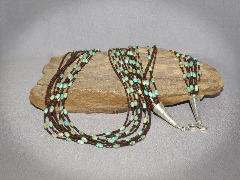 9 strand Small Rice Turquoise, Brown seed beads, sterling silver cones and clasp - 36 in Necklace is $210.00